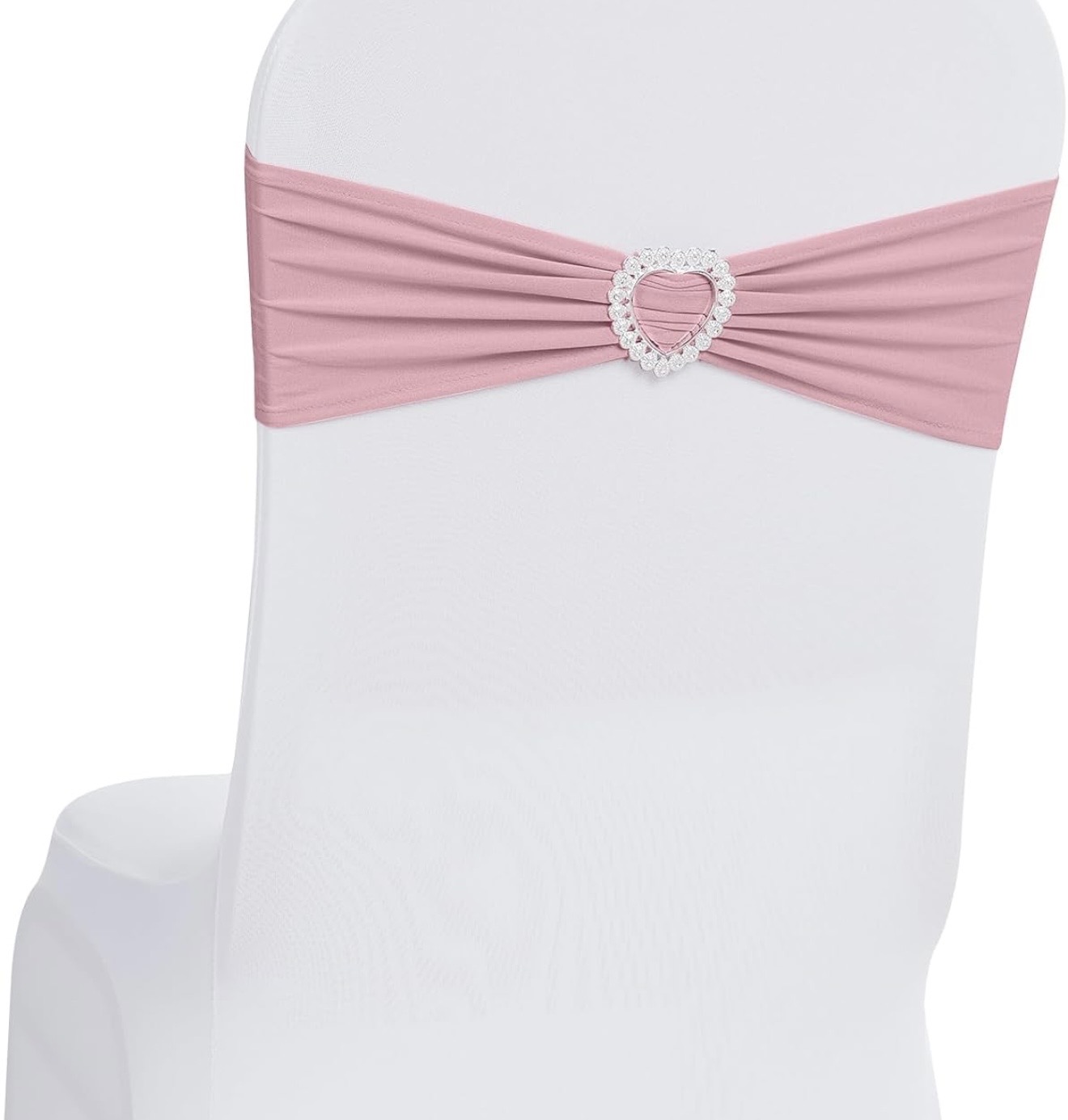 White chair with a dusty rose sash and heart rhinestone buckle